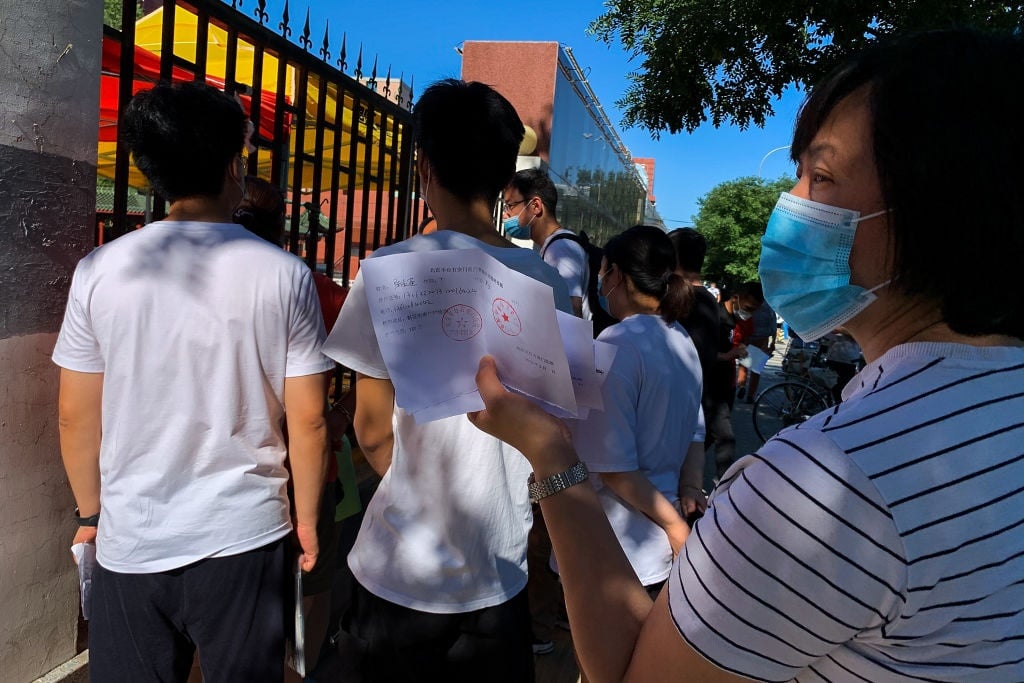 People wait in line at a hospital on in Beijing, China, amid new concerns over a rise in cases of Covid-19. 