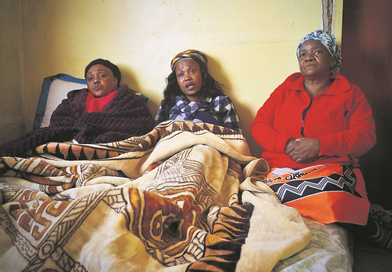 From left: Sanelisiwe Mfaba’s mother, Winnie Mfaba, sister Xolile Mfaba and family friend Patricia Monnye.                          Photo by Lucky Morajane