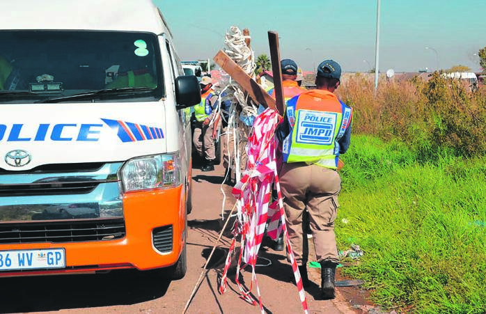 Metro cops confiscated illegal structures after a land invasion in the south of Jozi which sparked a protest.            Photo by Sifiso Jimta