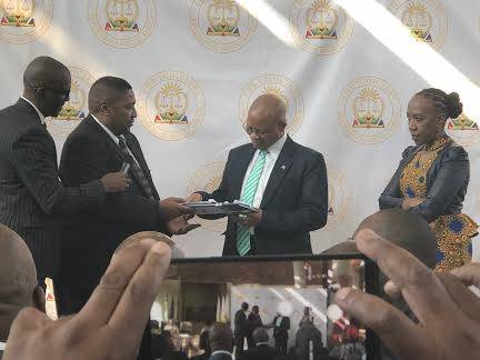 IEC chairperson Glen Mashinini hands over the list of politicians to represent the country in the national assembly andf provincial legislature to Chief Justice Mogoeng Mogoeng. Picture: Juniour Khumalo 