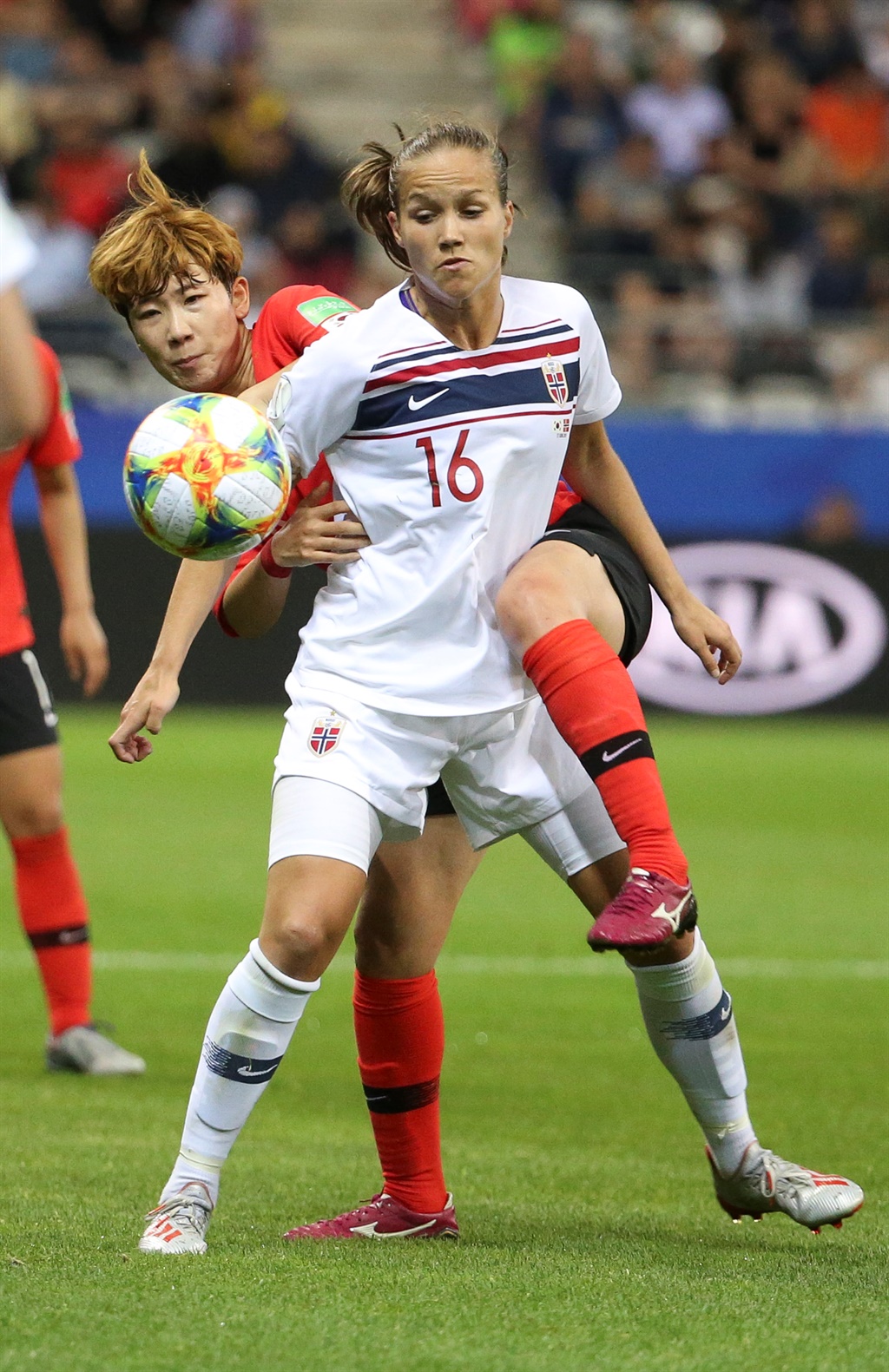 Guro Reiten of Norway and Moon Mira of South Korea compete for the ball during the 2019 FIFA Women's World Cup France group A match between South Korea and Norway at Stade Auguste Delaune on June 17, 2019 in Reims, France. (Photo by Jean Catuffe/Getty Images)