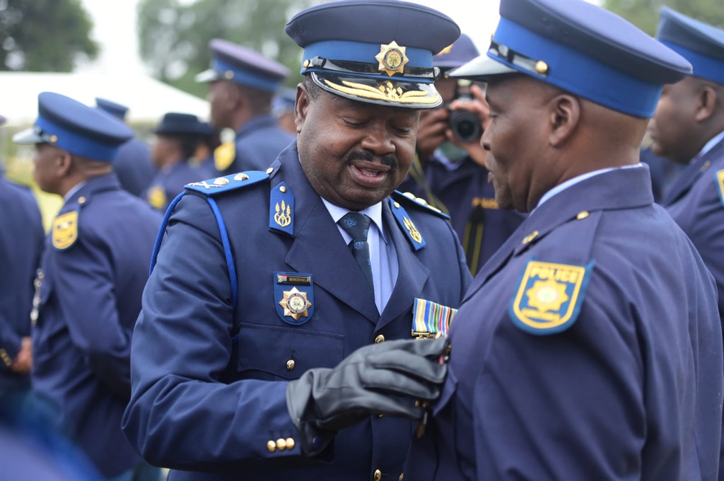 The Commissioner, Major-General Azwinndini Nengovhela, honours members of SAPS for their faithful service. Photo Raymond Morare