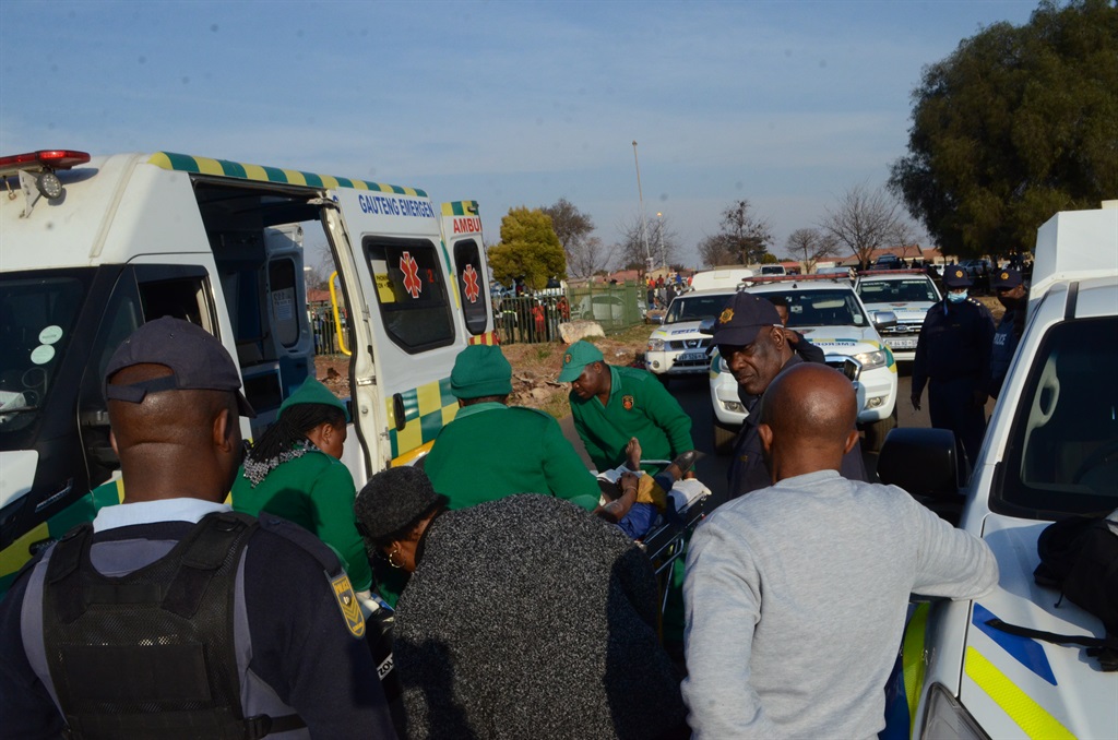 One of the suspects taken to an ambulance. Photo by Happy Mnguni