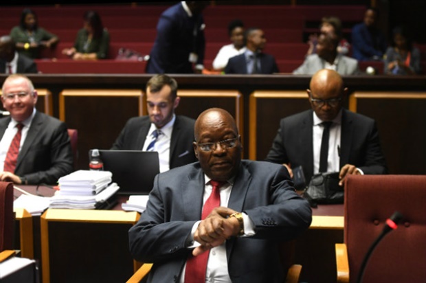<p><em>Former president Jacob Zuma checks his wristwatch during court proceedings against him. (PHOTO: Felix Dlangamandla)</em></p>