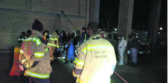 Rescuers at the scene where two men died after falling into a manhole at Kolonnade Shopping Mall in Tshwane.