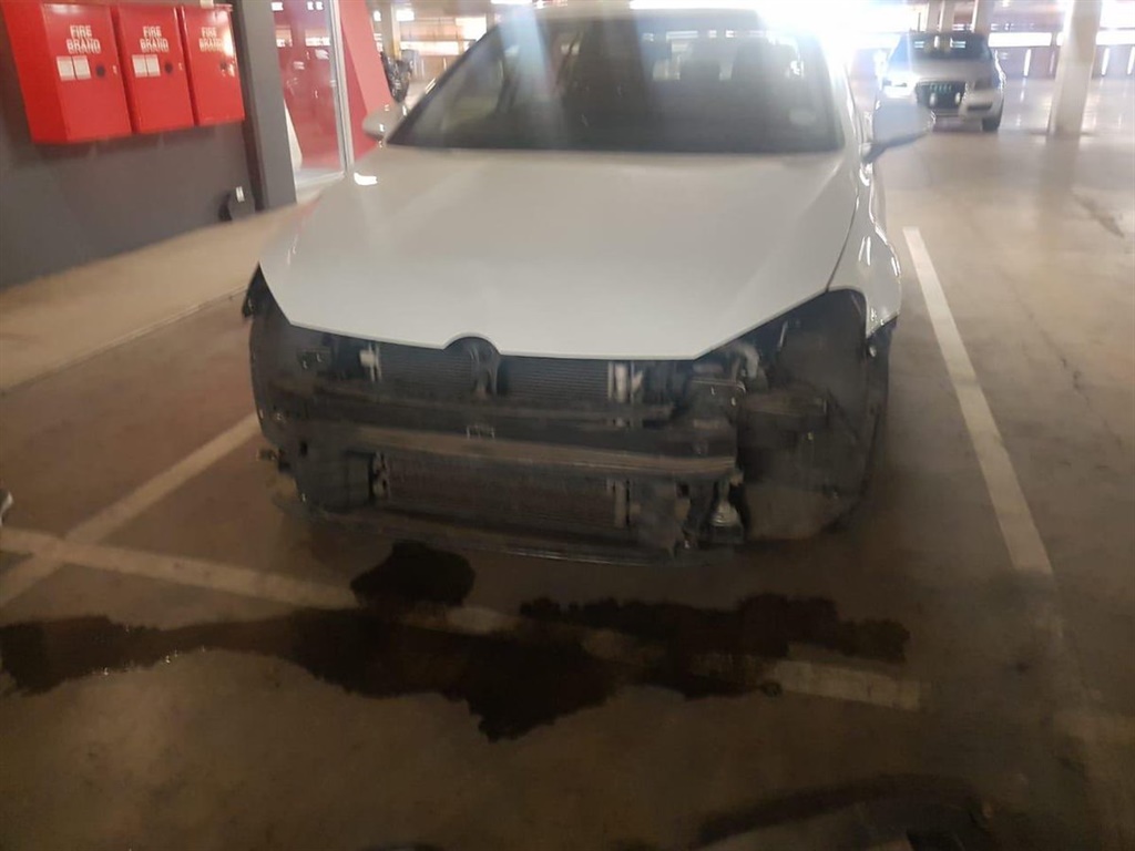 This car was apparently stripped while parked at the mall 