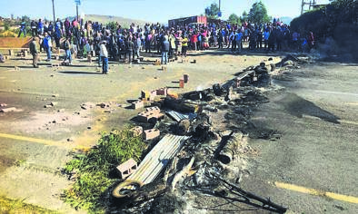 Villagers closed off a road with burning tyres and rubbish during the protest. Photo by Zimbili Vilakazi
