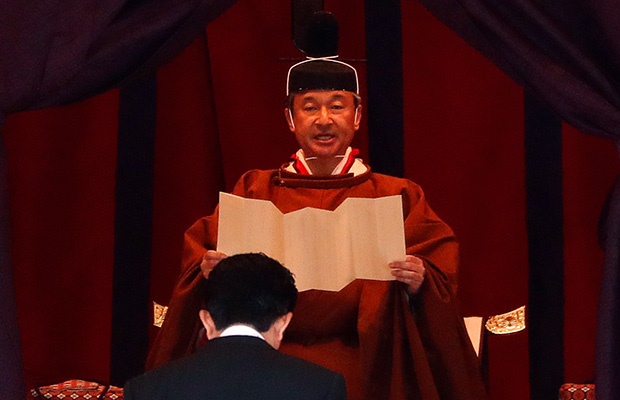 Emperor Naruhito speaks near Japan's Prime Minister Shinzo Abe during a ceremony to proclaim his enthronement. (Getty Images)