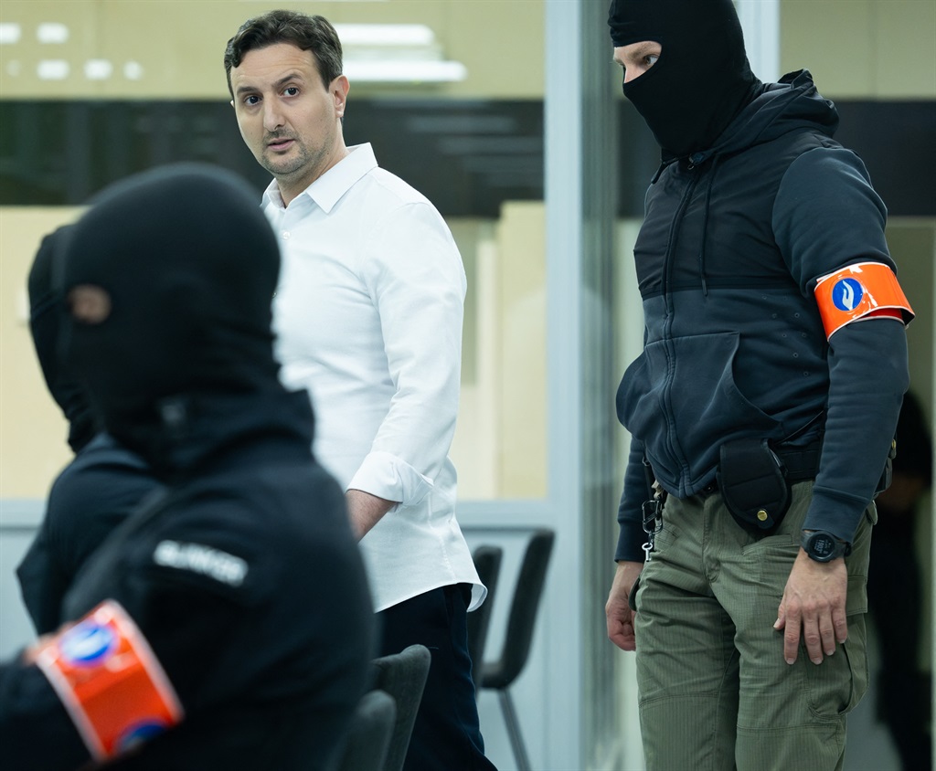 Defendant Ali El Haddad Asufi arrives at hearing for the verdict reading in the trial of the 2016 jihadist attacks on Brussels' Zaventem airport and Maalbeek/Maelbeek metro station, at the Bruxelles-Capital Assizes Court in the Justitia site in Haren, Brussels, on July 25, 2023. 

