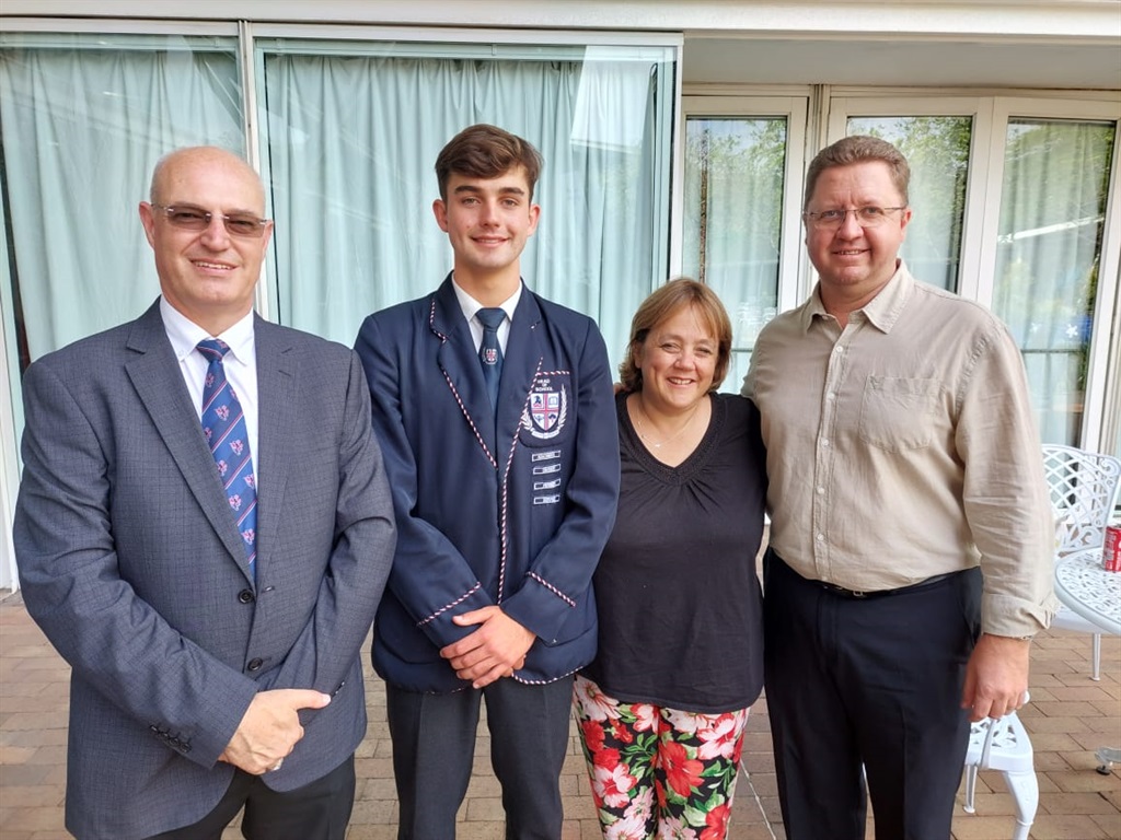 From left to right: Westville Boys High School principal Graham Steele, the country's 3rd best mathematics learner James Dent, his mother Carol and his father Jeff.
