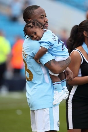 Raheem Sterling of Manchester City with his daughter Melody Rose Sterling 