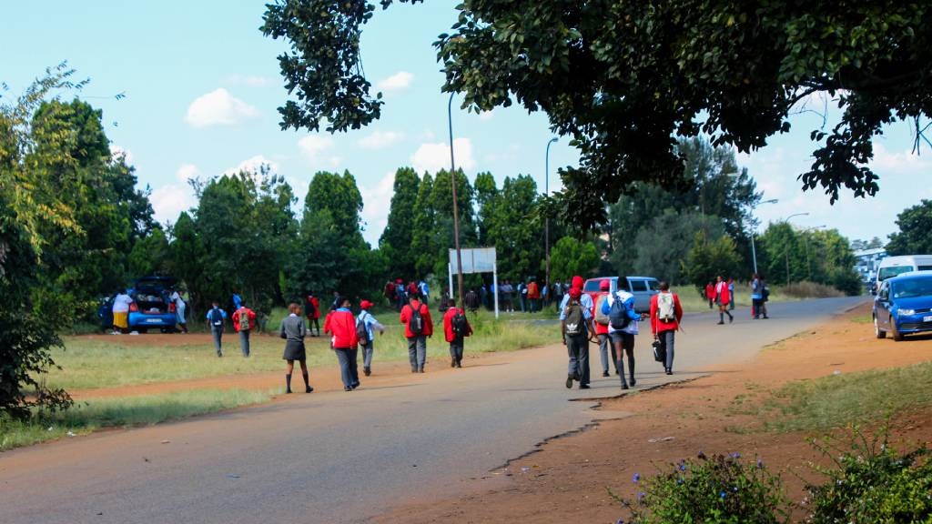 Children walk to Phoenix Secondary School.