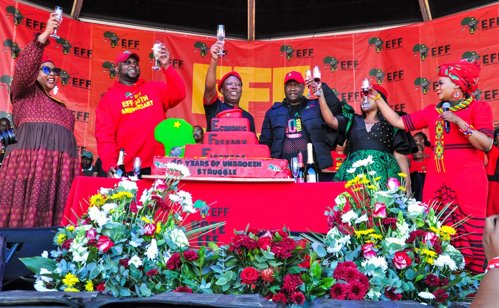 EFF Top 6 cutting the cake at the 10th anniversary of the party in Marikana. Photo by Rapula Mancai 
