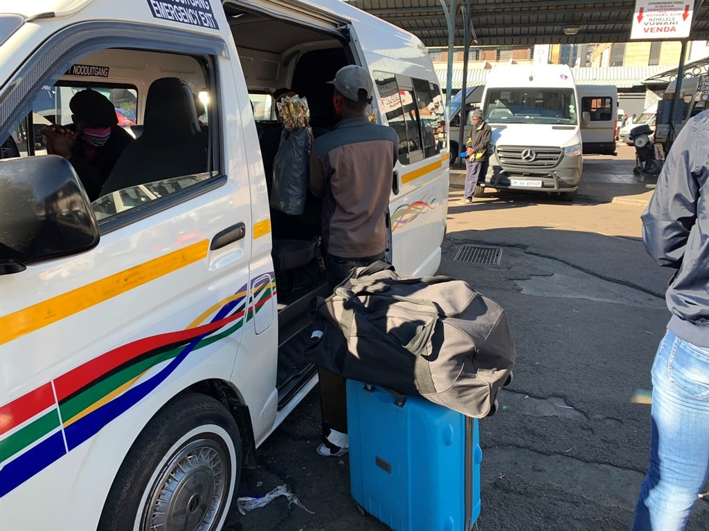 Taxis that conduct long distance travel loading at 100% capacity at Wanderers' taxi rank.