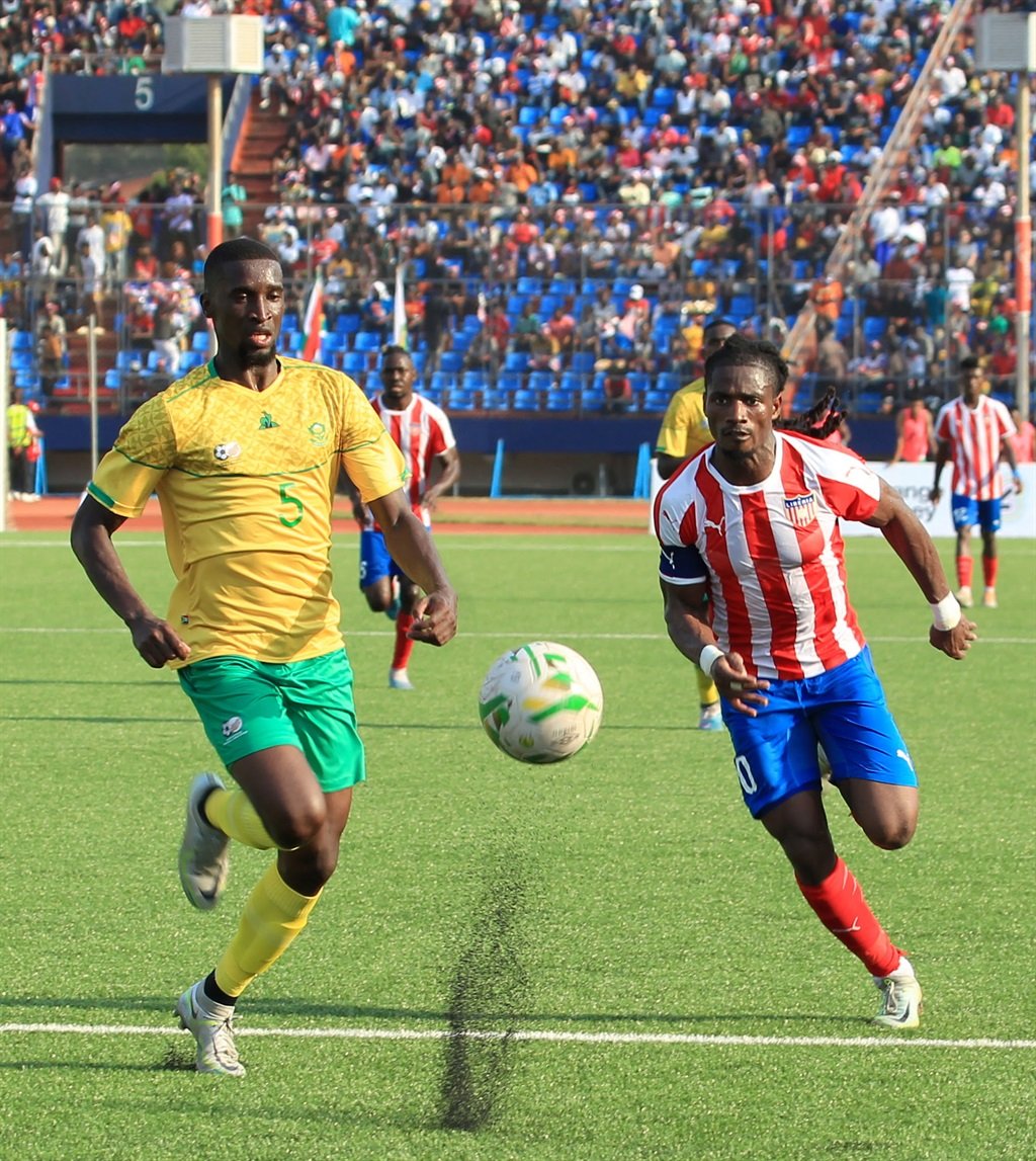 South Africa player Siyanda Xulu (L), and Liberian player William Jerbo (R) in action during the AFCON qualification match between Liberia and South Africa at the Samuel Kanyon Doe Sports Stadium, in Paynesville, Liberia, 28 March 2023 