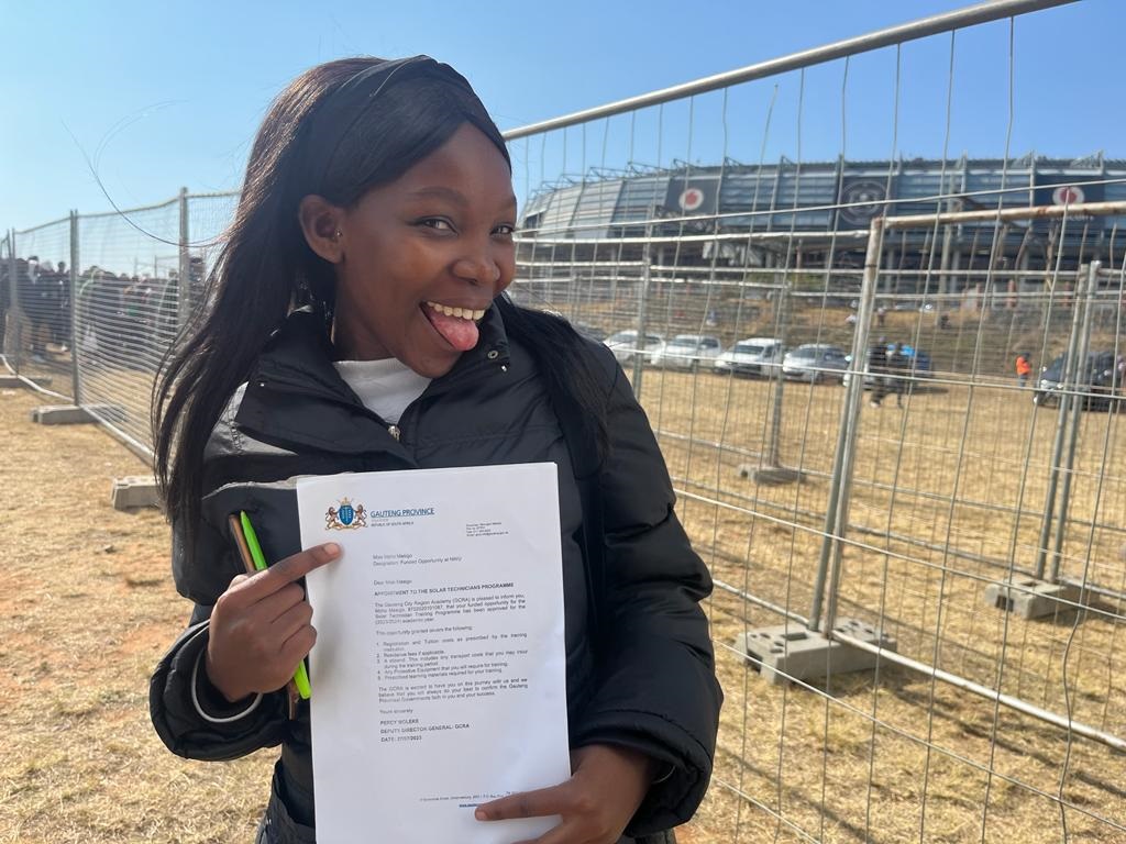 Mpho Masigo received her appointment letter for the solar technician programme. Photo by Nhlanhla Khomola