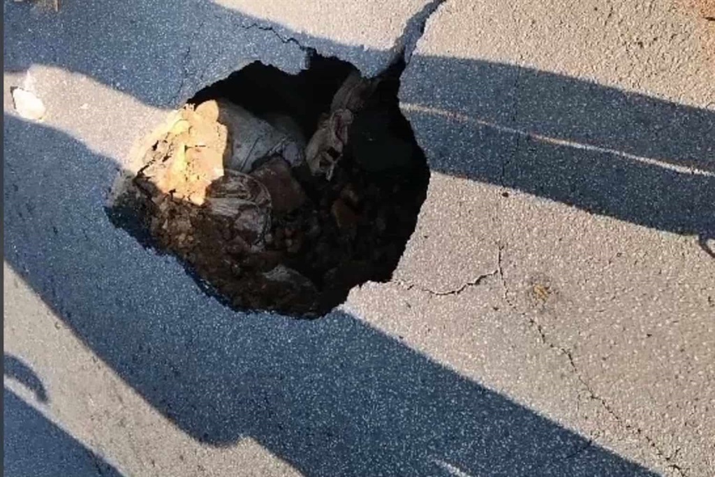 Miles Stoker Road closed due to a sinkhole caused by illegal mining activity.