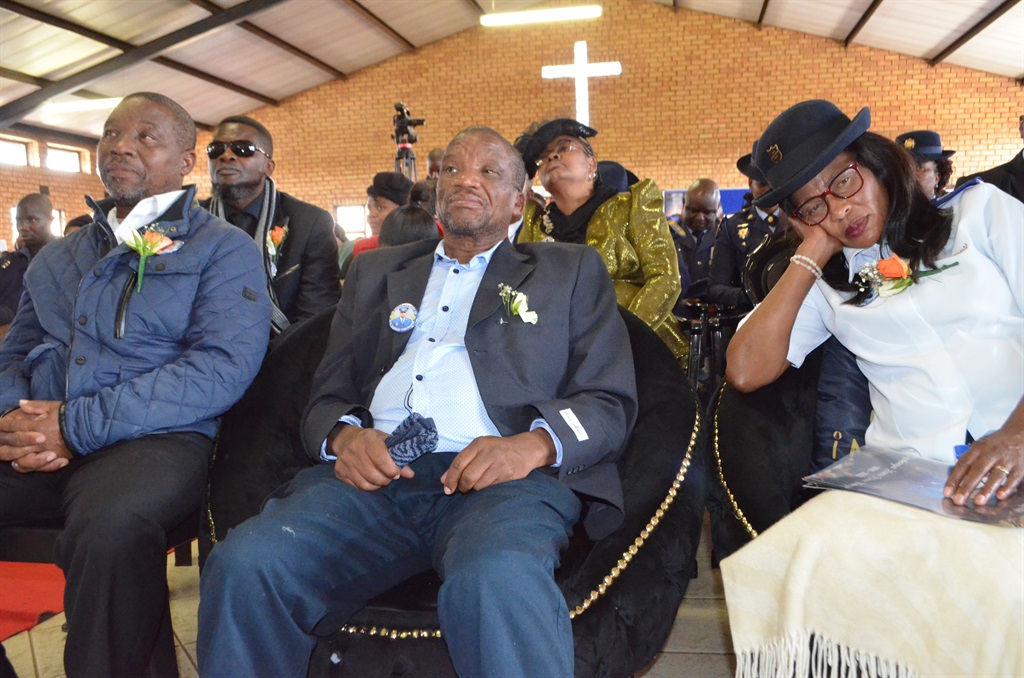 Grieving Thango family members listening to speakers at the funeral service of their late son, Constable Siyabonga Thango. Photo by Happy Mnguni