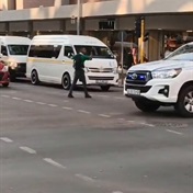 WATCH: Kid controls traffic while 'LAZY' cops drive past!   