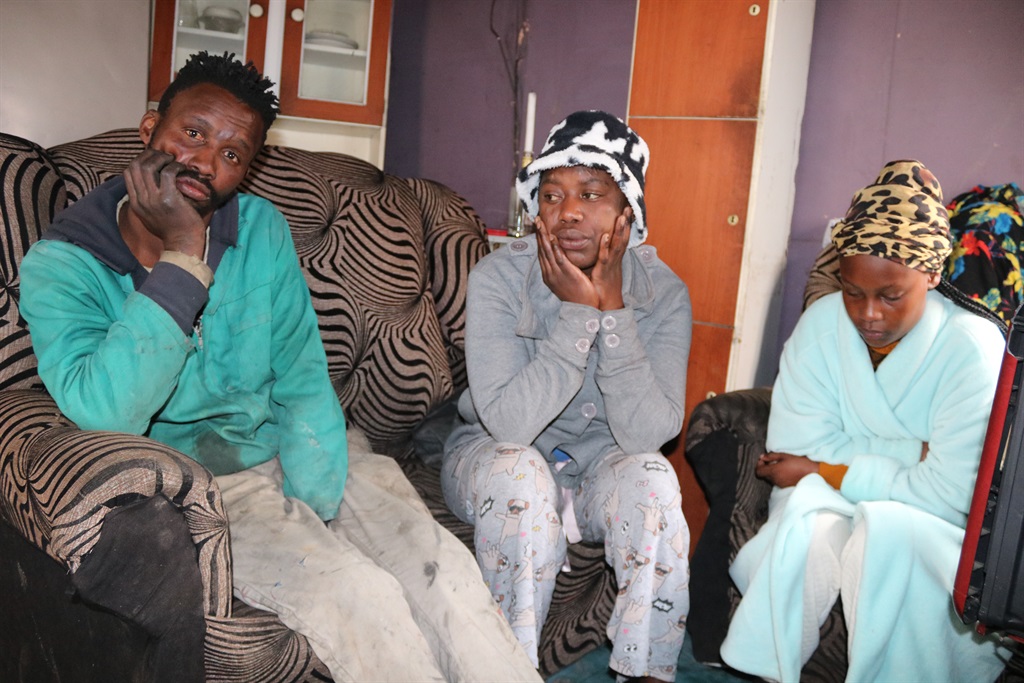 From left: Family members Thando Shweni, Nonceba Saliwa and Pozisa Shweni are still in shock. Photo by Lulekwa Mbadamane