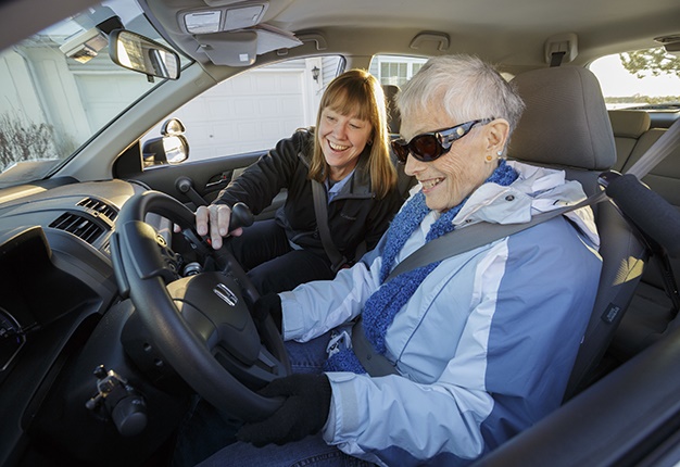 Elderly woman driving car UK. (Photo by: Photofusi