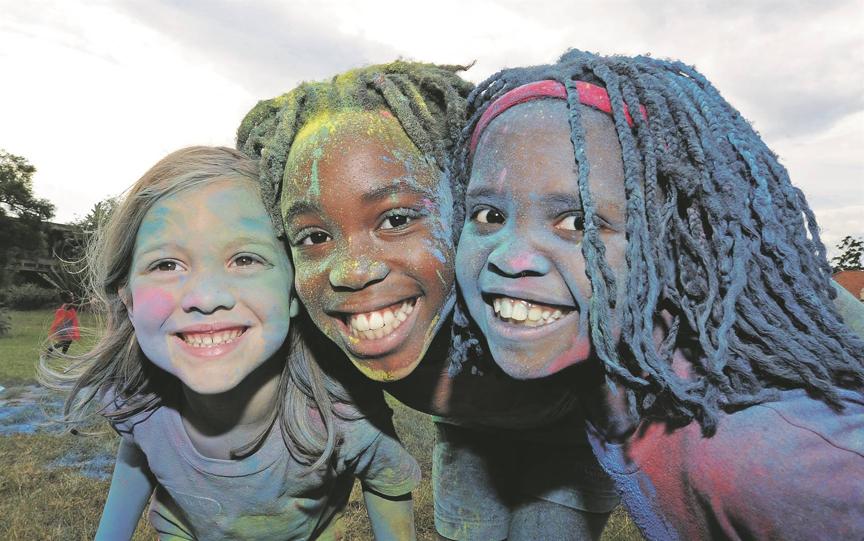 From left: Samantha (4), Emma (9) and Christina Tait (7) show their true colours. The writer argues that South Africa has to change tact to achieve meaningful social cohesion Picture: Ian Carbutt