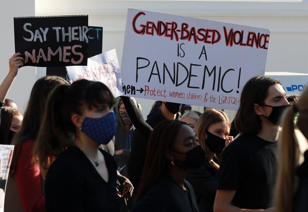 Protesters wearing face masks to protect against the coronavirus, seen during a gender-based violence protest outside parliament on June 30, 2020 in Cape Town. Photo by Nardus Engelbrecht/ Gallo Images via Getty Images