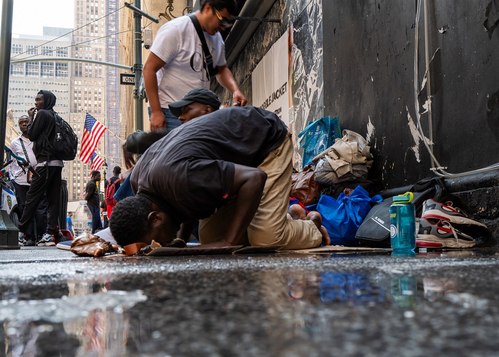 NEW YORK, NEW YORK - JULY 31: A Muslim man prays a
