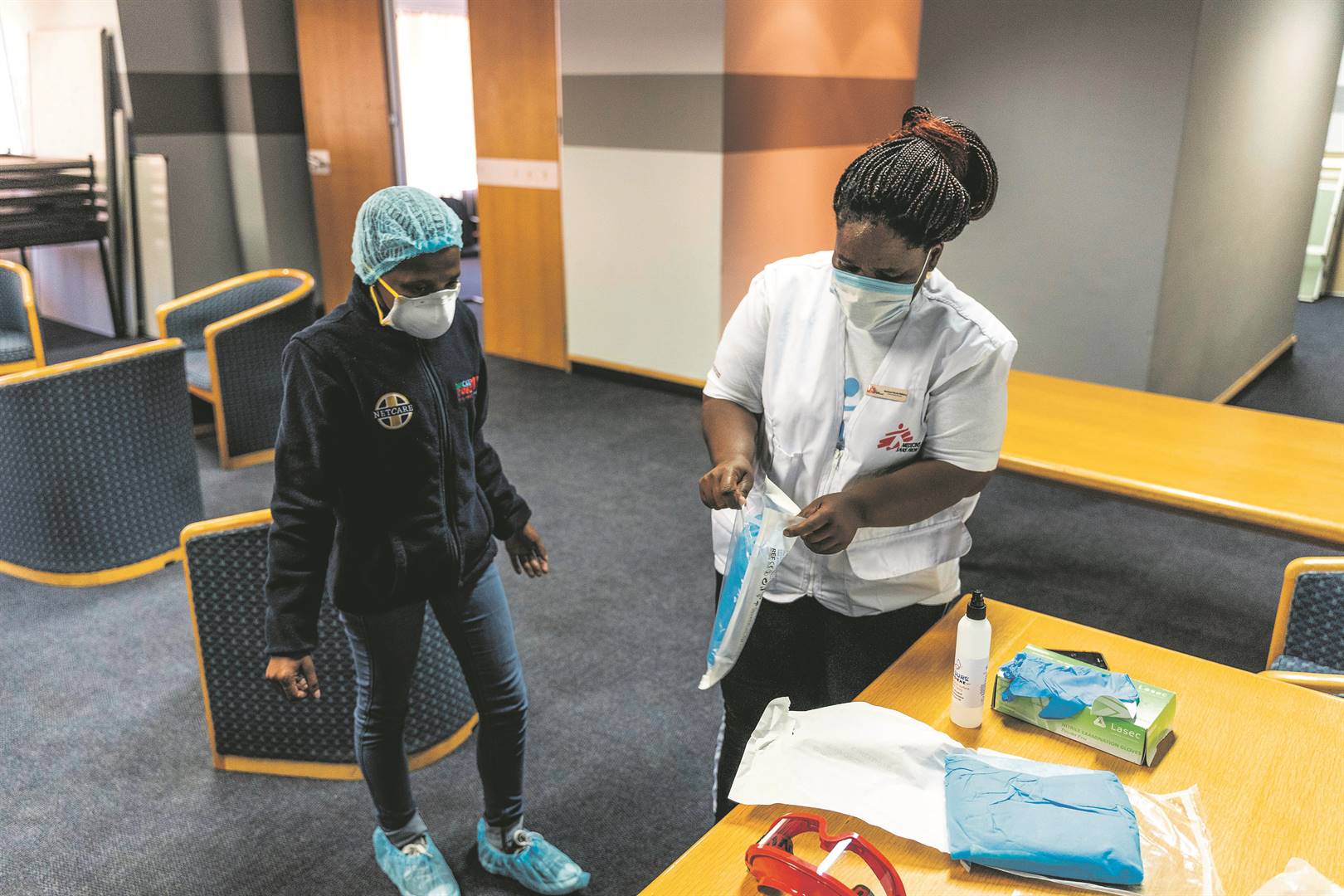 Bhelekazi Mdlalose (right) is a forensic nurse who has been educating people about the spread of Covid-19 in communities
