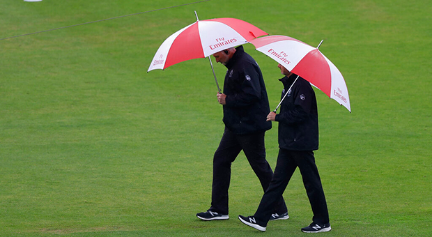 Umpires in the rain (AP)