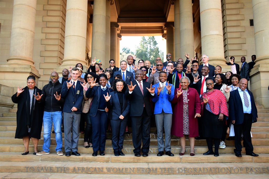 President Cyril Ramaphosa with invited stakeholders on the Women’s Monument Stairs, Union Buildings during public signing ceremony of the Sign Language Bill into the law.