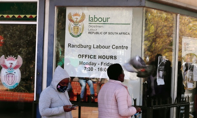 People queuing outside the department of labour. 
