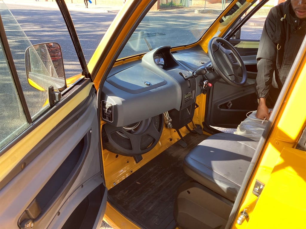 The front seat of the Bajaj Qute.
