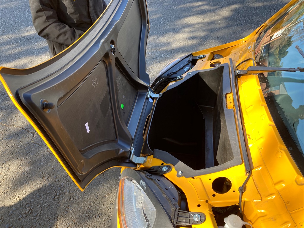The boot at the front of the Bajaj Qute.