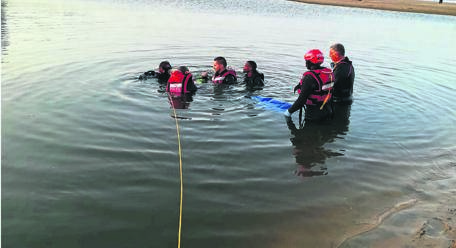 Police divers recovered the body of Ndumiso Mzobe 3 metres down, with his legs trapped under a log.