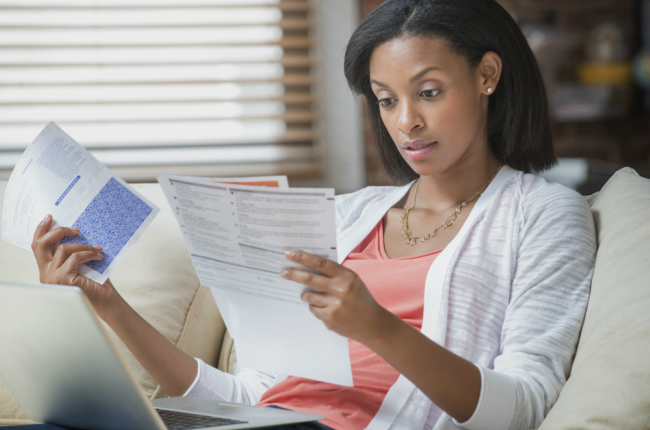 Woman looking at her financial statements.