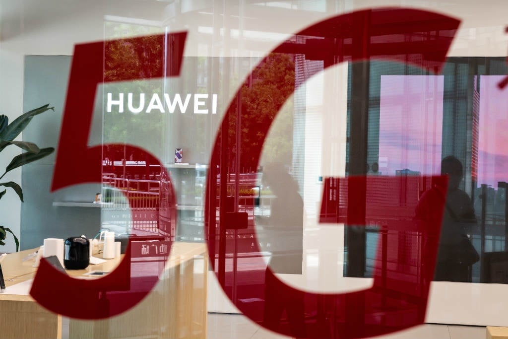 This file photo taken on 25 May 2020, shows a shop for Chinese telecom giant Huawei featuring a red sticker reading "5G" in Beijing, China.