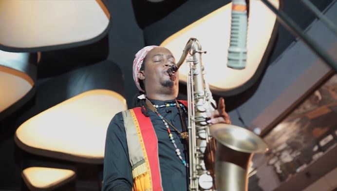 Linda Sikhakhane leads the band to play towards a path pursuant of passion above all else. (YouTube) 