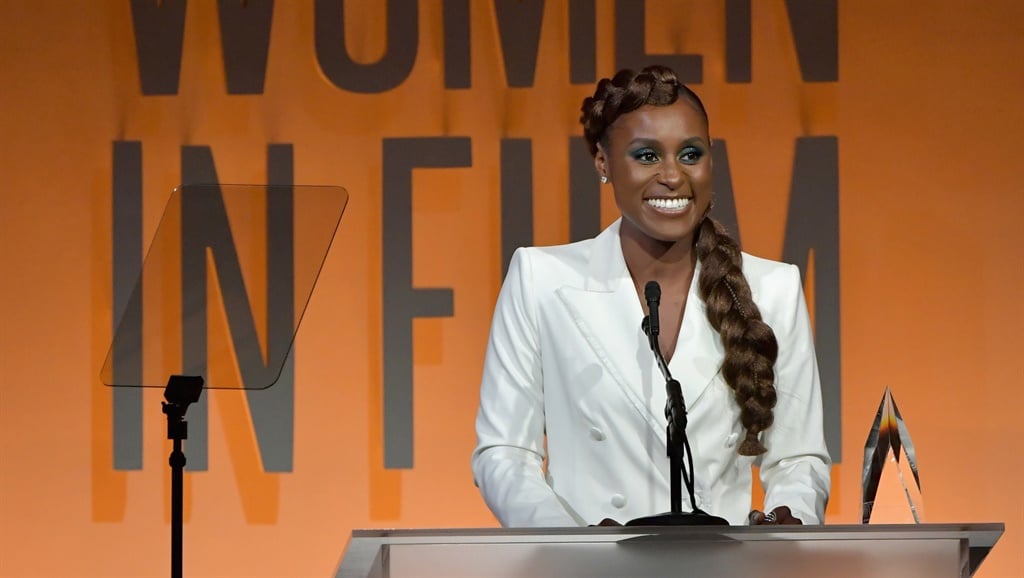 Issa Rae, wearing Max Mara, accepts the Women in Film Emerging Entrepreneur Award onstage at the 2019 Women In Film Annual Gala