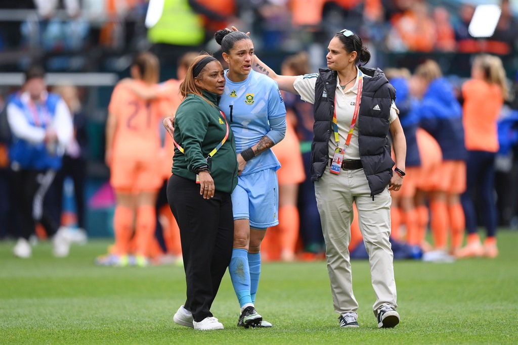 Kaylin Swart of South Africa  is consoled by head coach Desiree Ellis. (Photo by Justin Setterfield/Getty Images)
