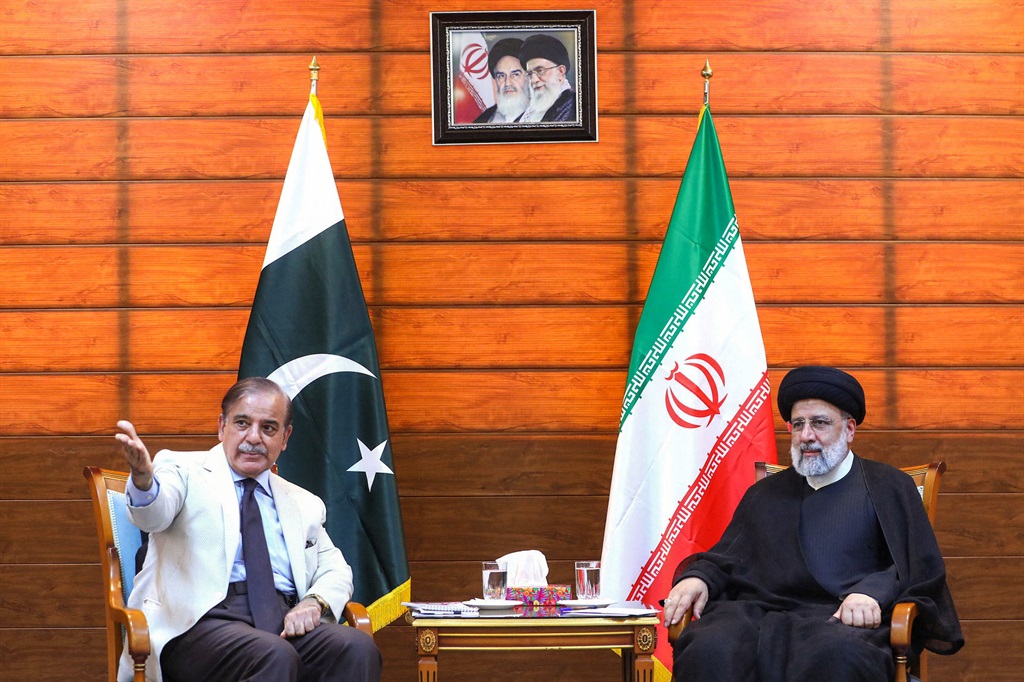  Pakistan's Prime Minister Shahbaz Sharif meets Iran's President Ebrahim Raisi in May 2023, after a ceremony to inaugurate a new border market in the city of Pishin. 