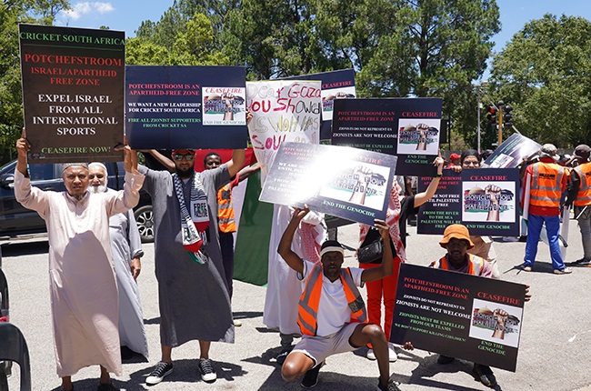 Protesters with their placards at the JB Marks Oval while the opening game of the Under-19 World Cup between South Africa and the West Indies was in progress. (Alfonso Nqunjana/News24)