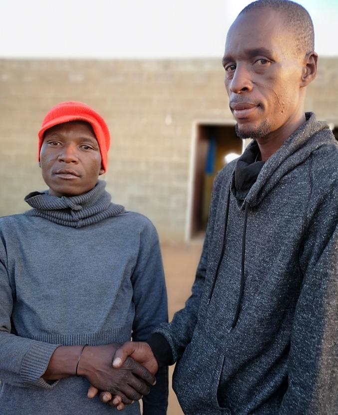 Left: Monaheng Makhina is happy to have been saved from the shack fire by his neighbour, Paseka Bruintjies, in Khayelitsha, Mangaung.  Photo by Kabelo Tlhabanelo