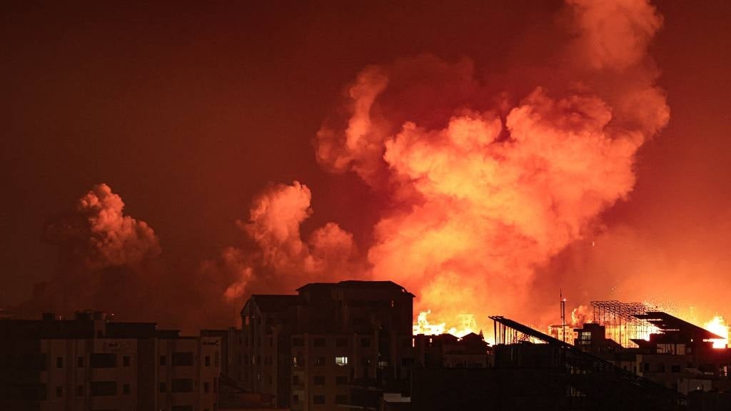 A fireball erupts during Israeli bombardment of Gaza City. (Mahmud Hams/AFP)