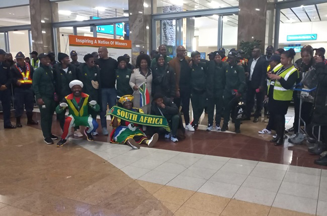 A group of Banyana Banyana players pose with Ministers Zizi Kodwa and Nkosazana Dlamini-Zuma at the OR Tambo International Airport on Thursday.