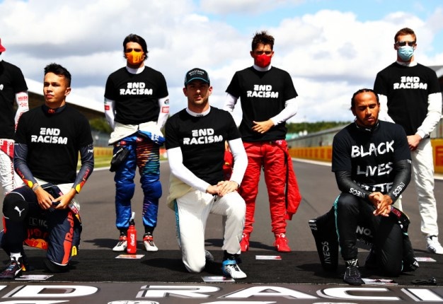 F1 drivers kneel on the grid in support of the Black Lives Matter movement before the F1 Grand Prix of Great Britain. (Photo by Dan Istitene - Formula 1/Formula 1 via Getty Images)