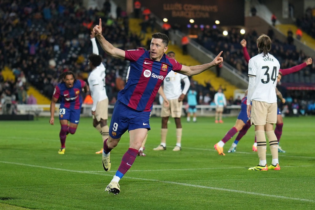BARCELONA, SPAIN - APRIL 29: Robert Lewandowski of FC Barcelona celebrates scoring his teams second goal during the LaLiga EA Sports match between FC Barcelona and Valencia CF at Estadi Olimpic Lluis Companys on April 29, 2024 in Barcelona, Spain. (Photo by Alex Caparros/Getty Images)