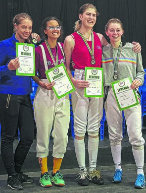 Rebecca Pretorius (second from right) after she won the sabre event at the women’s fencing tournament in Cape Town this week