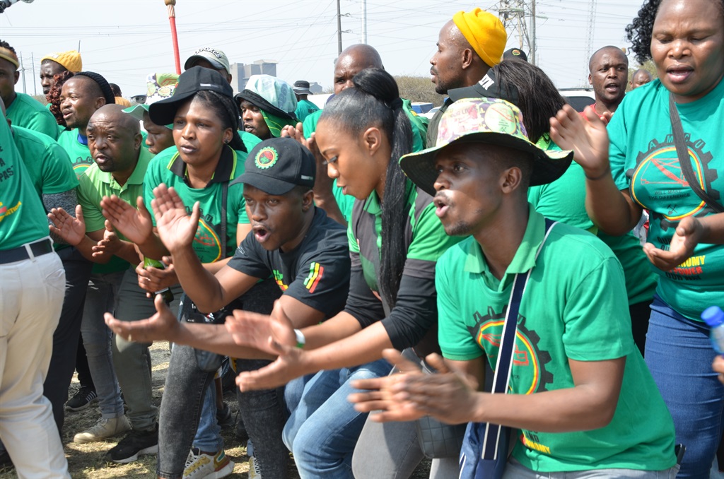 Mineworkers gathered at the Marikana Koppie near R
