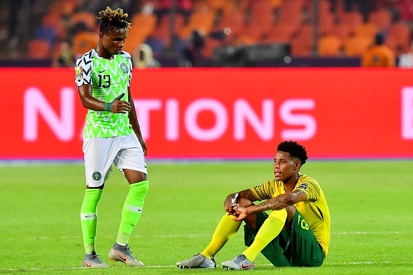 Nigerias forward Samuel Chukwueze (L) consoles South Africas midfielder Bongani Zungu following the 2019 Africa Cup of Nations (CAN) quarter final football match between Nigeria and South Africa at Cairo international stadium on July 9, 2019
